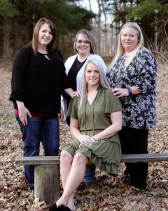 Sisters Heidi, Brittany and Heather with their late motherʼs hospice nurse, Cassie.