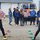 Students watch Regional Superintendent Kyle Thomson, PhD, and SBL Healthy Communities Director Laura Bollan engage in a friendly competition using the new equipment