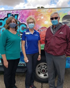 Pictured (left to right) Paris Bridges Principal Michelle Young, SBL Healthy Communities Director Laura Bollan and teacher Bill Hall.